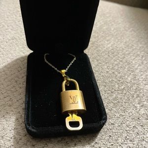 Louis Vuitton lock and key necklace. 18” long. Lock number 319.